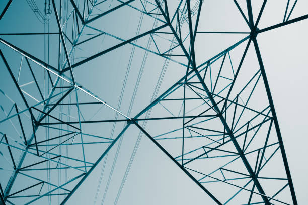 istock Abstract pattern from bottom view of high voltage pole power electricity transmission tower post. 1619961323