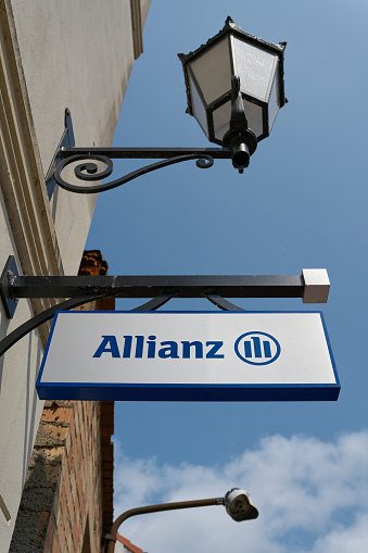 Wismar, Germany – May 26, 2023: Sign of an insurance agency of the company Allianz in the city center of Wismar in Germany