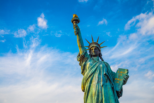 Statue of liberty and rainbow bridge landmark in Odaiba, Tokyo Japan. Travel in Japan concept.