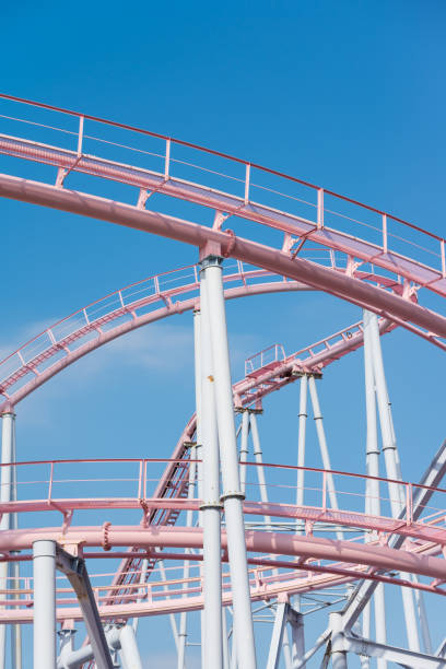 istock Pink pastel looping rollercoaster in amusement park. 1619972597