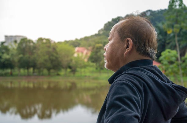 istock Tired senior man taking a break from exercising outdoors 1619988193