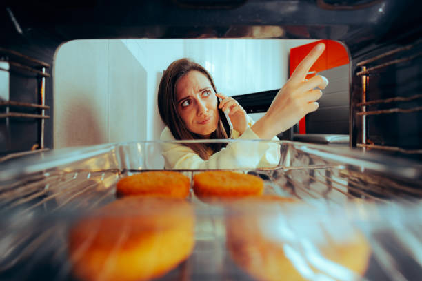 Woman Calling Repair Service for her Broken Cooking Over