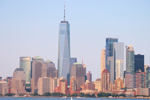 View of Manhattan skyline from New Jersey shores. Famous financial district having many high rise skyscrapers cover the Manhattan skyline. Situated on the banks of Hudson river