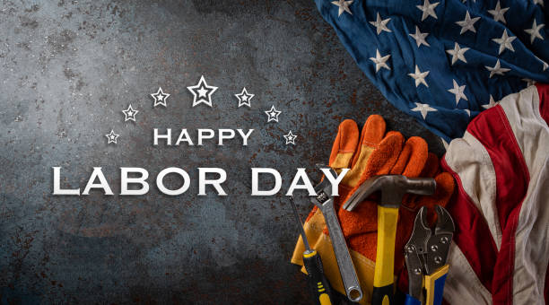 istock Happy Labor day concept. American flag with different construction tools and the text on dark stone background. 1620013845
