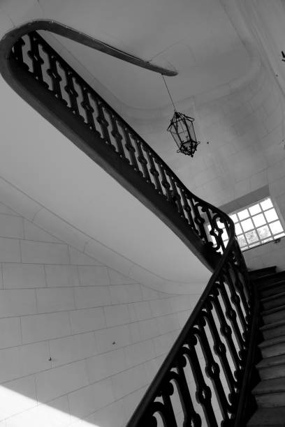 istock View bottom up on beautiful luxury staircase with wooden railings 1620036825