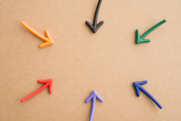 istock Color highlight arrows put around on wooden board background with copy space. 1620071620