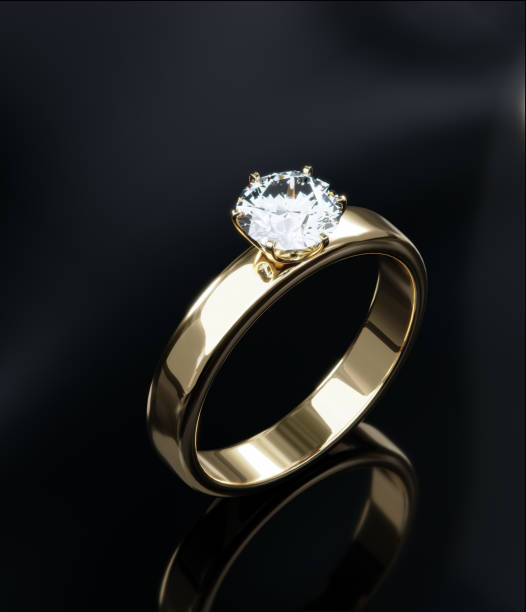 istock Top view gold diamond rings in a studio scene. 3D render design of the ring. 1620072216
