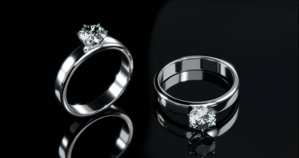 istock Top view Two platinum diamond rings in a studio scene. 3D render design of the ring. 1620072758