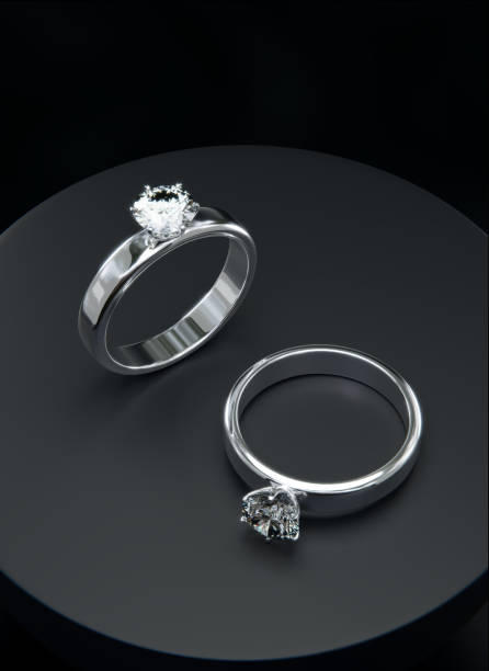 istock Top view Two platinum diamond rings in a studio scene. from design with 3D render. Ring 3d render. 1620072763