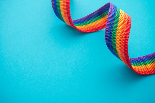 istock Rainbow headband LGBT like a LGBT pride flag on blue background. 1620075488