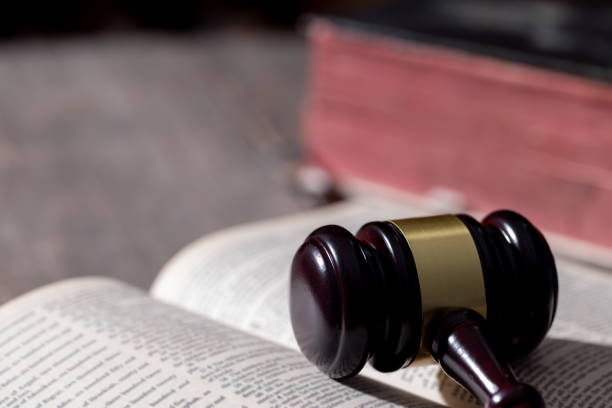 istock Holy bible book and judge's gavel on table background. Judicial system, constitution, democracy, rule of law. There are no people in the photo. There is free space to insert. 1620079521