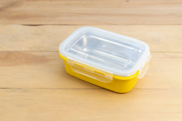 istock yellow food container on wooden table closeup 1620079738