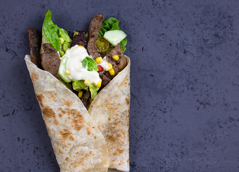 Steak and salad wrap - top view photo