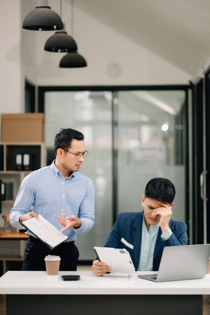 istock Furious two Asian businesspeople arguing strongly after making a mistake at work in office 1620195320
