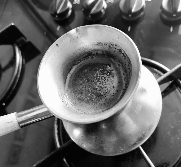 istock Barista preparing hot tasty drink from copper turk 1620218562