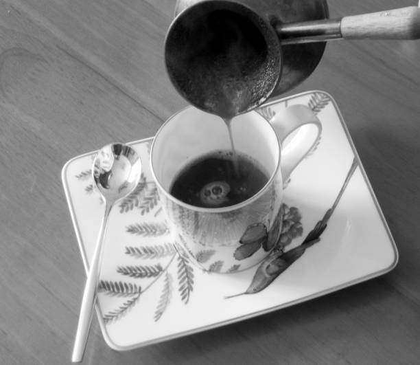 istock Barista preparing hot tasty drink from copper turk 1620219121