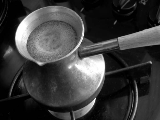 istock Barista preparing hot tasty drink from copper turk 1620219152