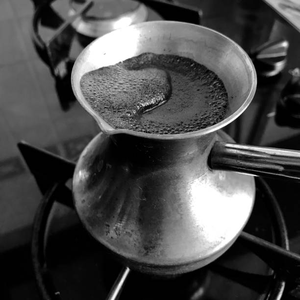 istock Barista preparing hot tasty drink from copper turk 1620219965