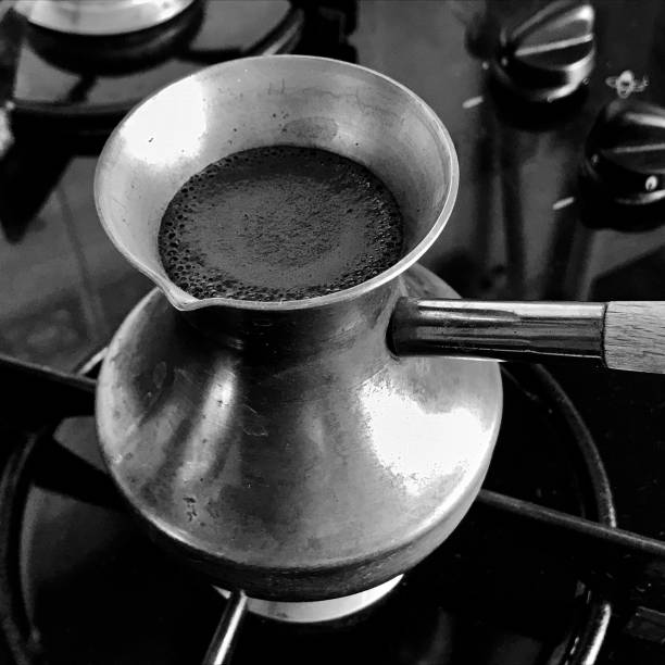 istock Barista preparing hot tasty drink from copper turk 1620220238