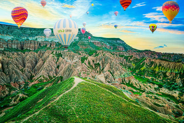 Cappadocia, Turkiye - July 07, 2023-Air balloons in Cappadocia-amazing and unreal views in valley.