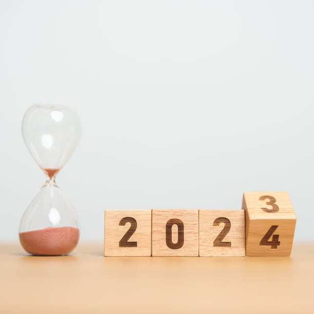 istock flipping block 2023 to 2024 text with hourglass on table. Resolution, time, plan, goal, motivation, reboot, countdown  and New Year holiday concepts 1620250050