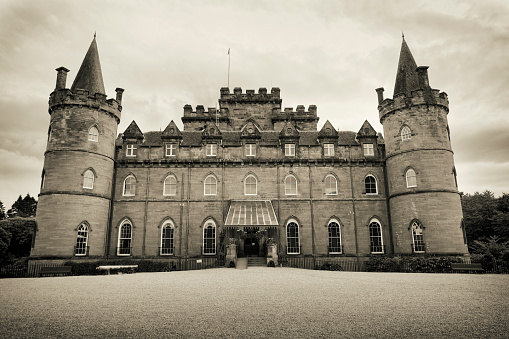 Inveraray, United Kingdom- July 21, 2023: Sepia toned photograph of Inveraray Castle, located by the Loch Fyne on the west coast of Scotland. Inveraray Castle was built in the 18th century.