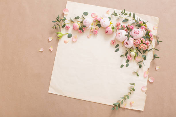 istock beautiful roses on background  old paper 1620311018