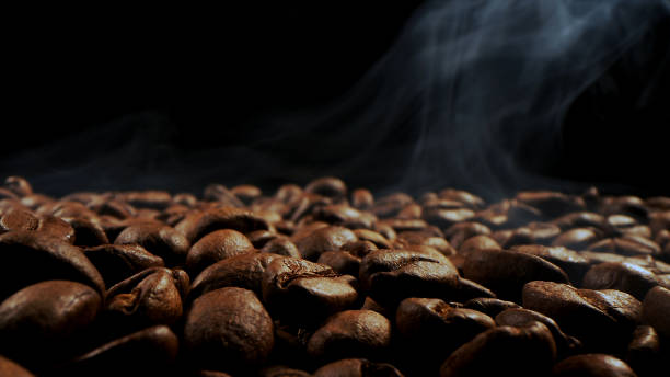 istock Aromatic, coffee roasted grains on a dark background. 1620321704