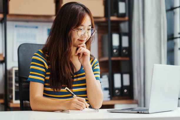 istock Excited Asian female student doing Online MBA and Business Degree Programs and learn indian language, online MBA course give you same level education provided conventional business school 1620327074