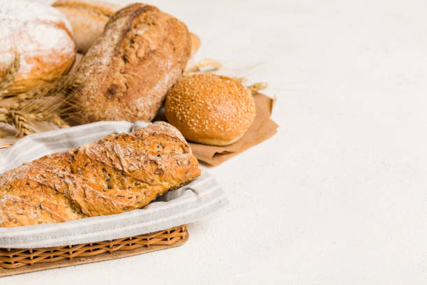 istock Homemade natural breads. Different kinds of fresh bread as background, perspective view with copy space 1620330855