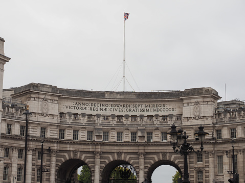 Admiralty Arch in Trafalgar Square in London, UK. Translation In the tenth year of King Edward VII, to Queen Victoria, from most grateful citizens, 1910