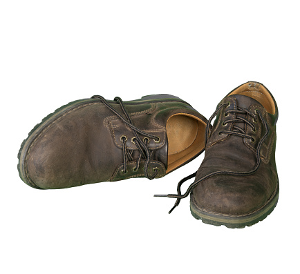 an old pair of men's shoes on a transparent background