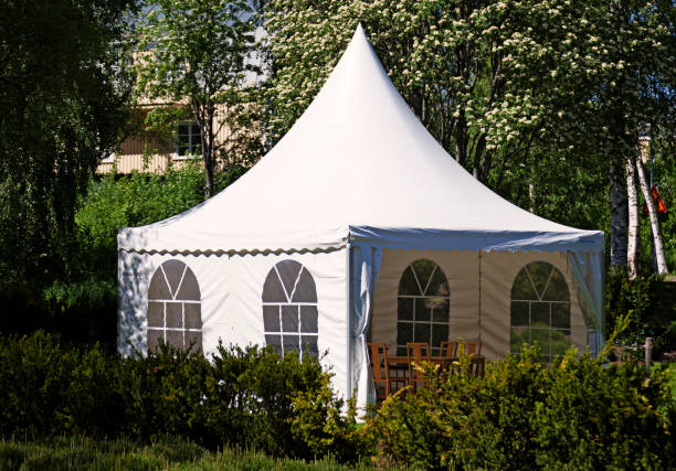 istock a white party tent spread out on the lawn 1620344629