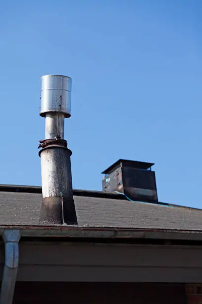 a strange chimney on the roof of a culture house
