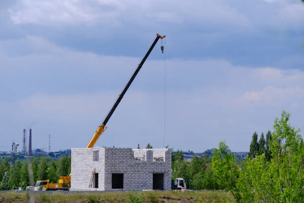 istock Frame of building under construction against background elongated crane boom.Construction site. 1620366411