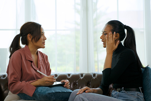 Psychologist interview patient at clinic. Mental health and health care concept.