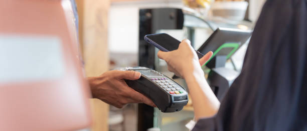 istock Woman use smartphone to scan QR code to pay in cafe restaurant with a digital payment without cash. Choose menu and order accumulate discount. E wallet, technology, pay online, credit card, bank app. 1620372991