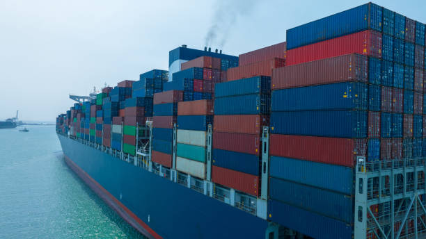 istock Stern of large cargo container ship import export container box on the ocean sea on blue sky back ground concept transportation logistic and service to customer and supply chang 1620397215