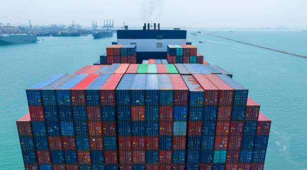 istock Stern of large cargo container ship import export container box on the ocean sea on blue sky back ground concept transportation logistic and service to customer and supply chang 1620397232