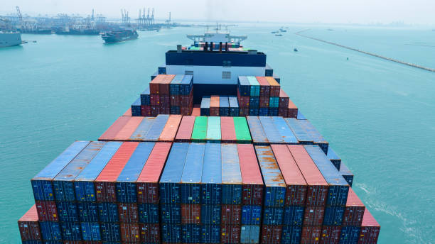 istock Stern of large cargo container ship import export container box on the ocean sea on blue sky back ground concept transportation logistic and service to customer and supply chang 1620397543