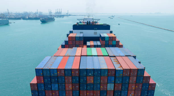 istock Stern of large cargo container ship import export container box on the ocean sea on blue sky back ground concept transportation logistic and service to customer and supply chang 1620397746