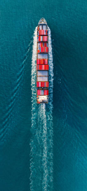istock banner,Top view of cargo container ship carrying container and running for export goods from cargo yard port to custom ocean concept technology transportation , customs clearance. forwarder 1620398365