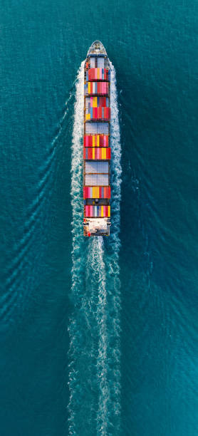 istock banner,Top view of cargo container ship carrying container and running for export goods from cargo yard port to custom ocean concept technology transportation , customs clearance. forwarder 1620400011