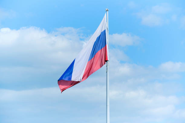 istock Tricolor, flag Russian Federation blue sky background. 1620408316