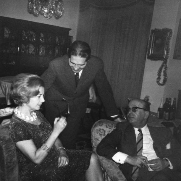 istock Happy people at a party in 1956. 1620429053