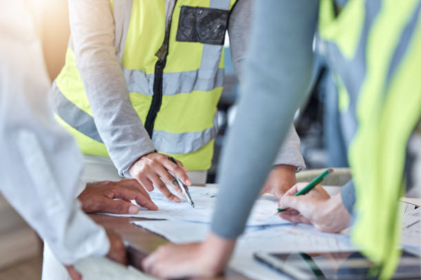 istock Planning, blueprint and engineering people hands for meeting, teamwork and construction design or collaboration. Paper, floor plan and person or group with sketch ideas, brainstorming or architecture 1620460024