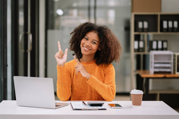 istock Happy young businesswoman presenting or pointing, happy working. 1620461834