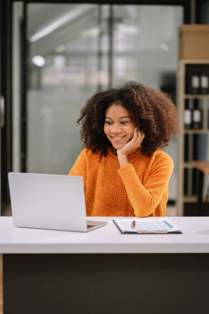 istock Female writes information businessman working on laptop computer writing business plan while sitting in office. 1620462367