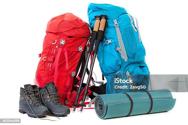 Hiking Gear With A Red And A Blue Backpack Shoes And A Mat Stock Photo - Download Image Now