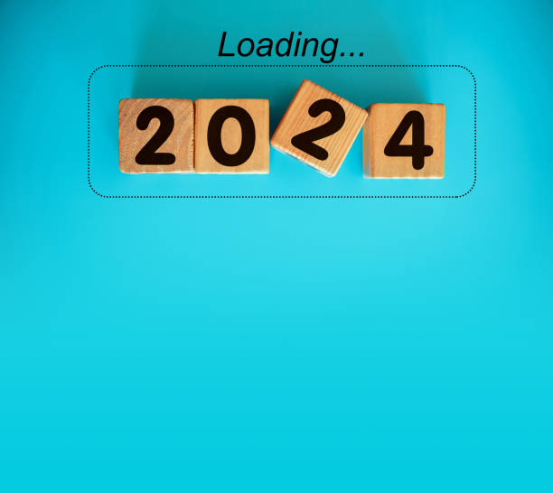 istock New Year 2024 with wood block isolated on blue 1620481563